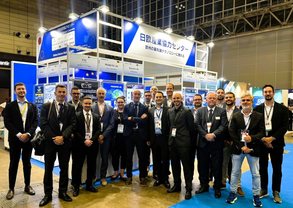 Group photo in front of the booth